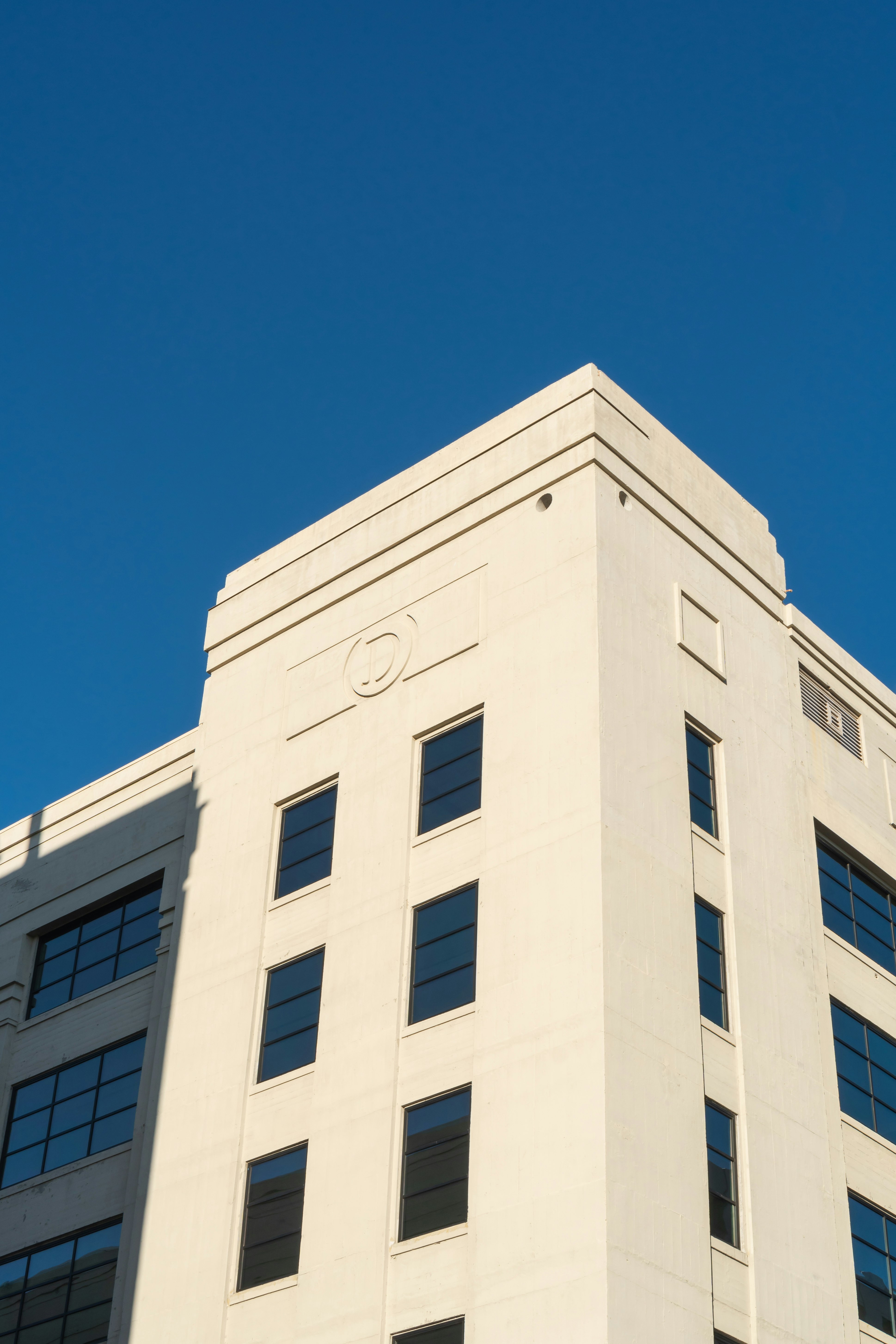 white concrete building under blue sky during daytime